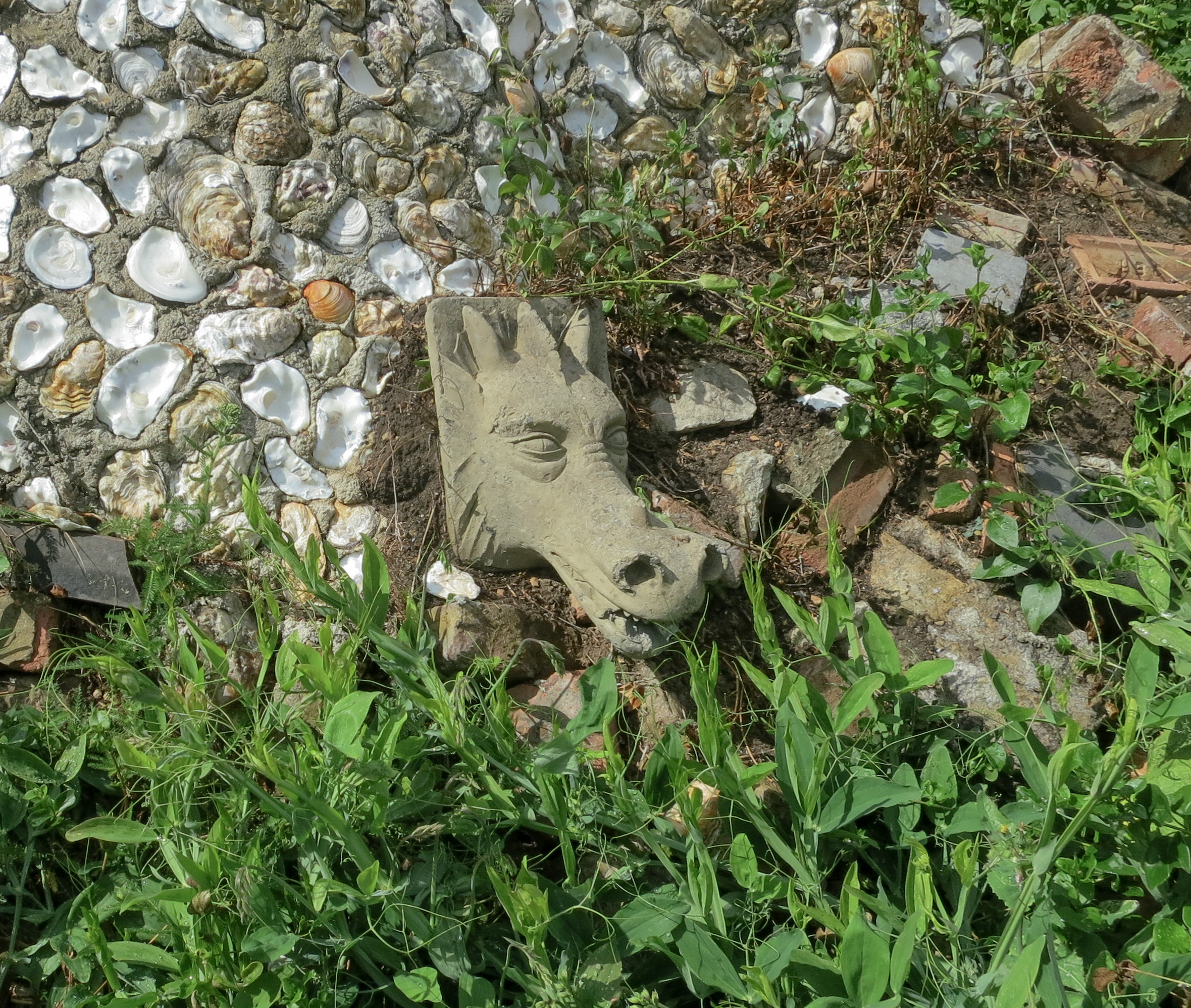 a stone dragon from the graveyard illustrating Reeves 2022 work Lessons from Crossbones Graveyard a more than individuated ethics of care